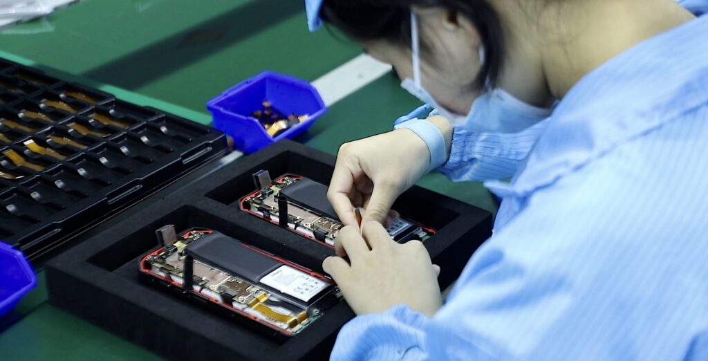 Workshop staff installing components